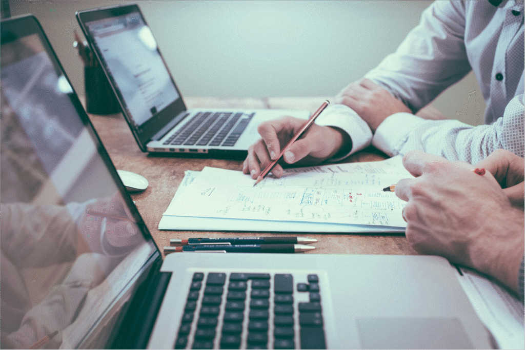 Tracking expenses on laptop and sheets